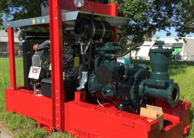 Stationary diesel motor pump for depleting heavily loaded water - mining applications